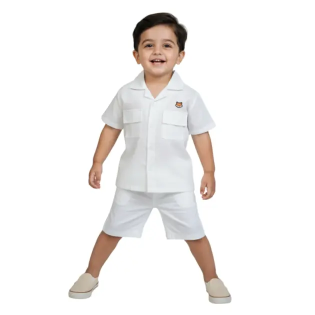 A stylish boy in the plain moon white cuban collar shirt by Orange - kids linen-cotton blend shirts in Pakistan.
